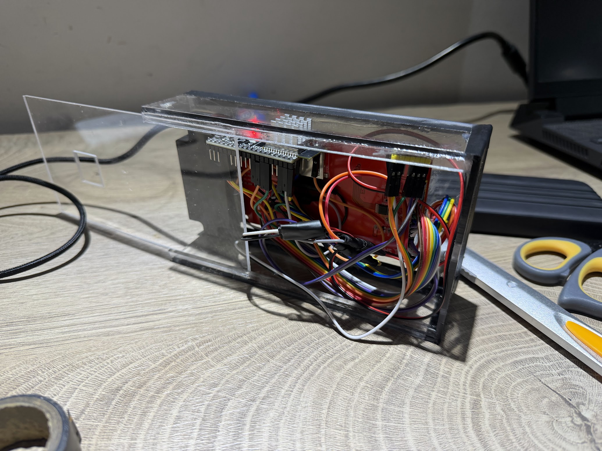 Wiring and boards packed inside a clear acrylic case